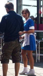 Jenna in waitress outfit. "Do you want fries with that?"